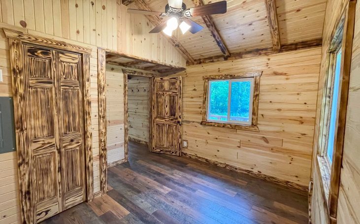 Bedroom inside rustic cabin built by the Amish