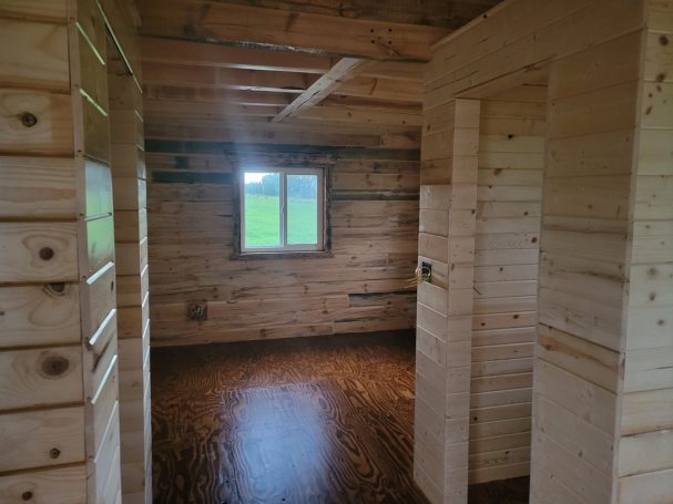 Bedroom with window and closet.